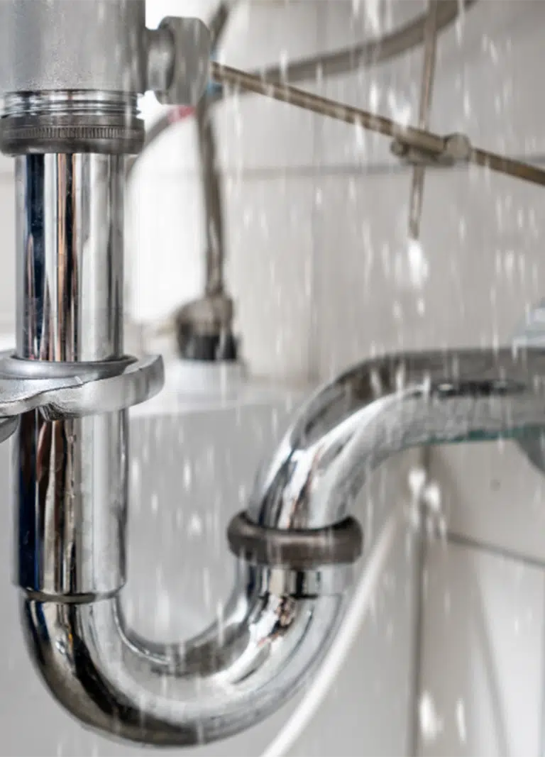 A Licenced Plumber quickly dealing with Burst Pipes Repairs On The Gold Coast for a homeowner