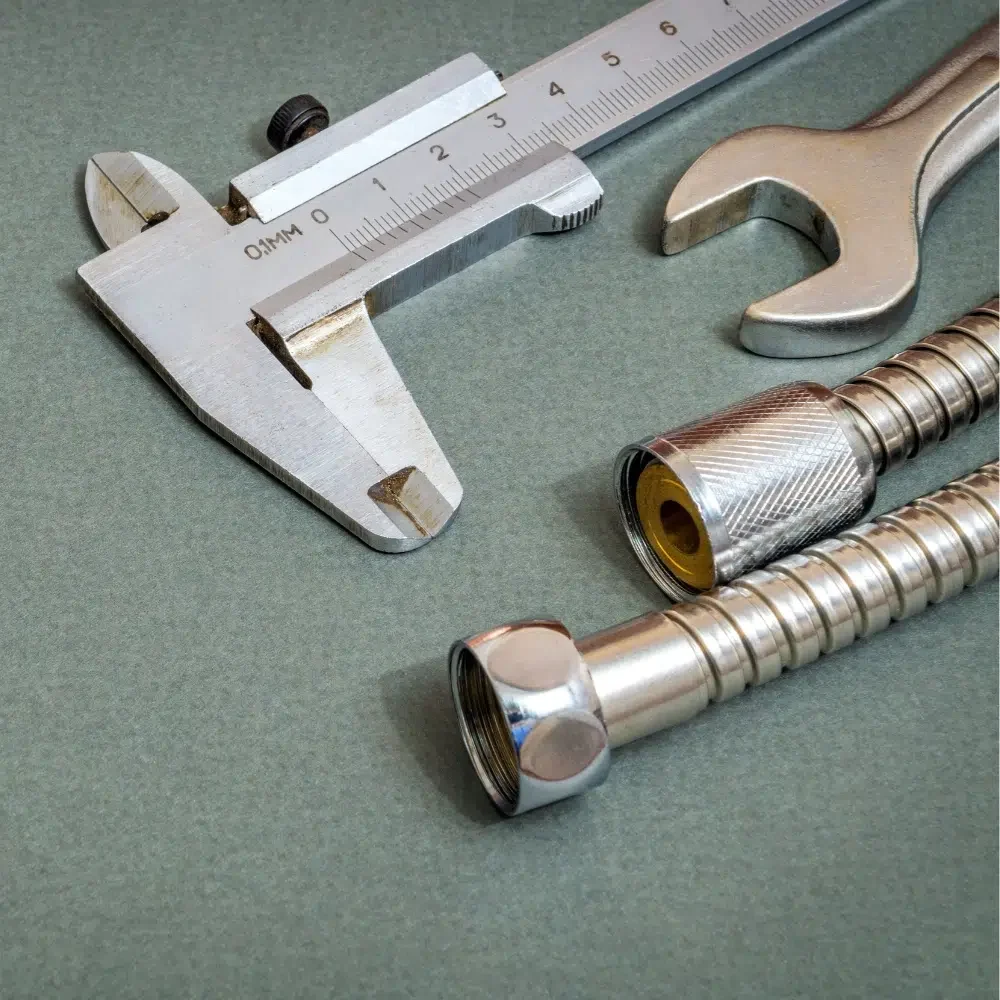 Chrome pipes and spanners used by plumbers for Affordable Shower Repairs on the Gold Coast