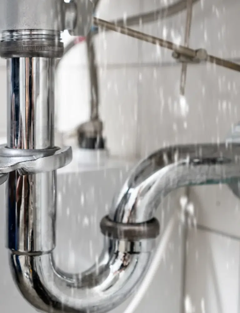 A Licenced Plumber quickly dealing with Burst Pipes Repairs On The Gold Coast for a homeowner