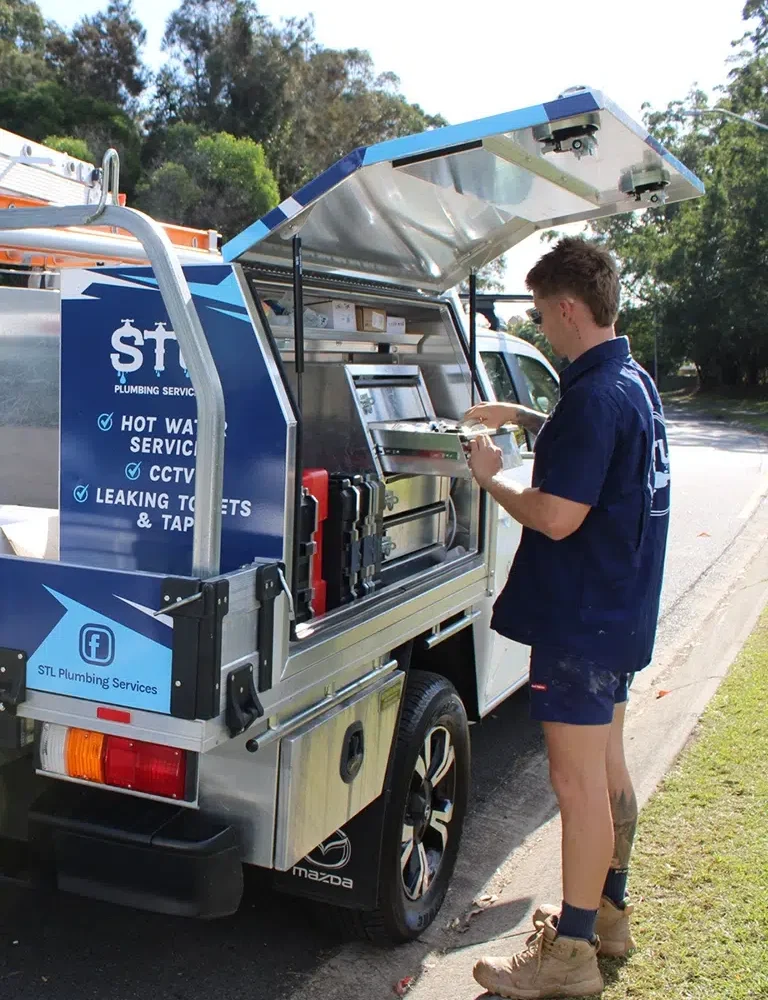 STL Plumbing's expert team unloading equipment from a ute providing Emergency Plumbing on the Gold Coast