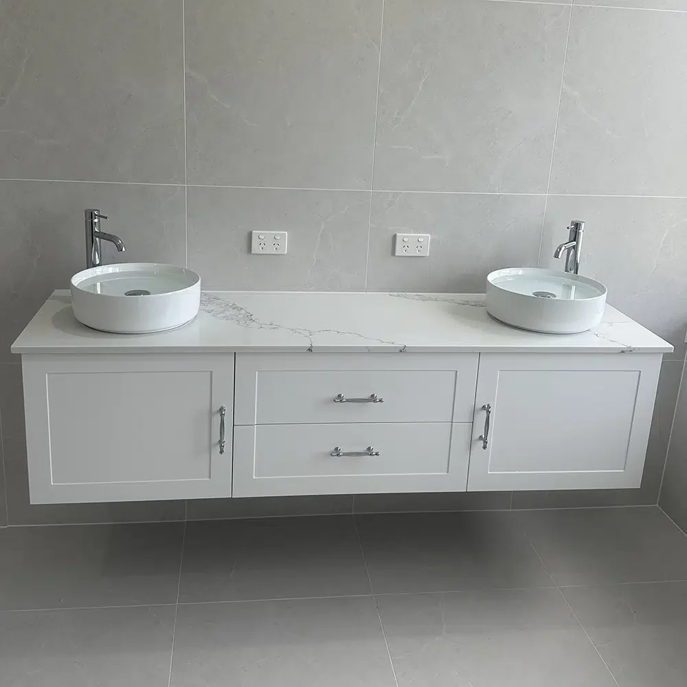 Plumbing for new homes on the Gold Coast. Stunning White finished bathroom vanity with two sinks and tap ware.